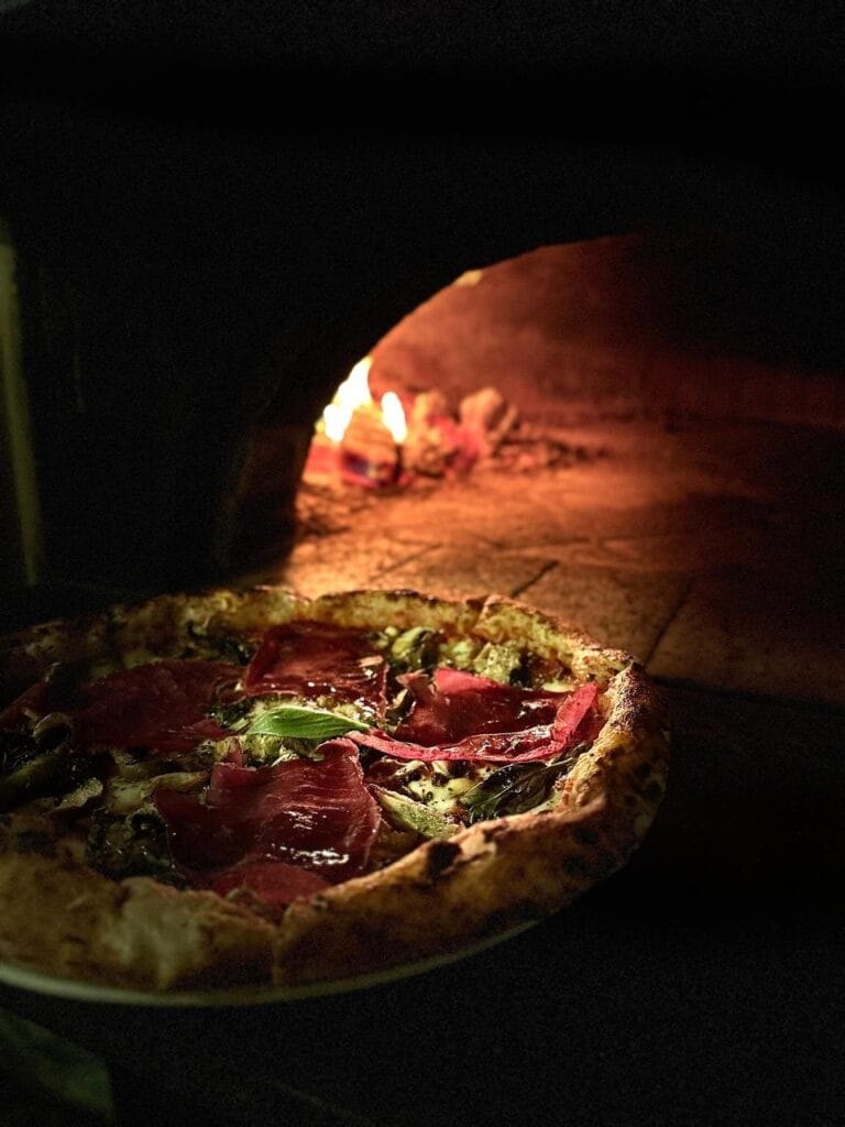 Pizza baking inside the Una oven
